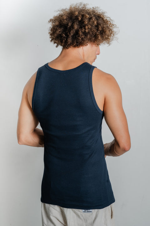 Male model showcasing Reer Endz navy organic cotton singlet