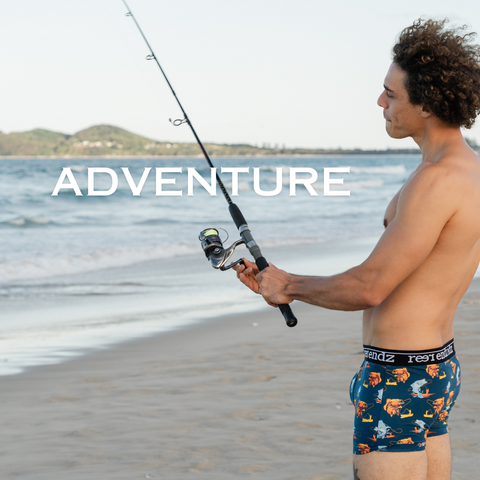 Male model wearing Reer Endz organic cotton trunks fishing