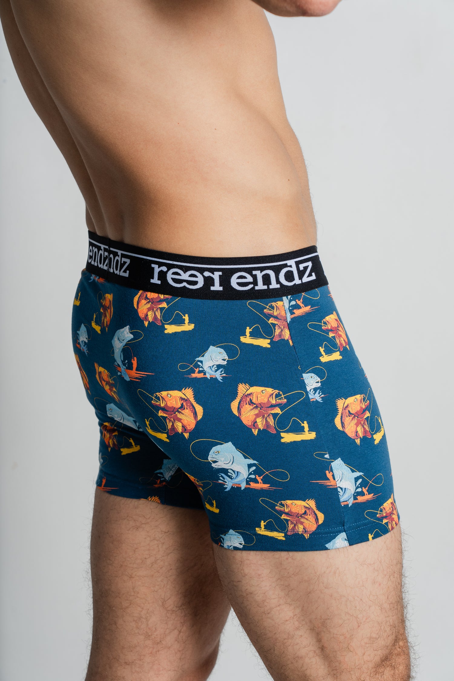 Male model wearing Reer Endz men's trunks, Hooked Print, made from Organic Cotton for exceptional comfort and eco-friendliness.
