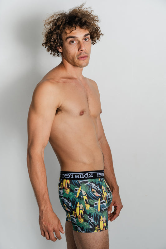 Male model in Reer Endz men's trunks – the chic Offshore Vibes Print crafted from eco-friendly Organic Cotton for ultimate comfort